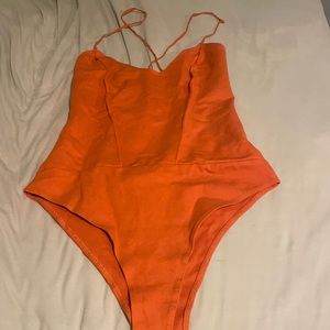 Orange body suit